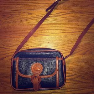 Navy leather Dooney and Bourke cross body purse